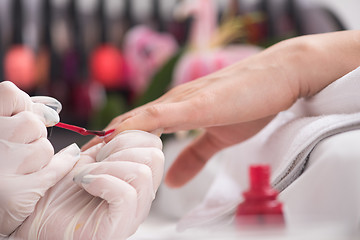 Image showing Woman hands receiving a manicure