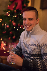 Image showing Happy young man with a glass of champagne