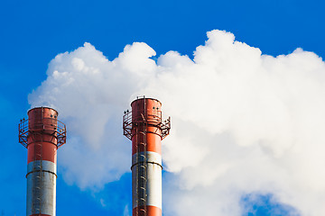 Image showing Stream of dark smoke from the chimney of factory