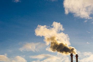 Image showing Stream of dark smoke from the chimney of factory