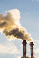 Image showing Stream of dark smoke from the chimney of factory