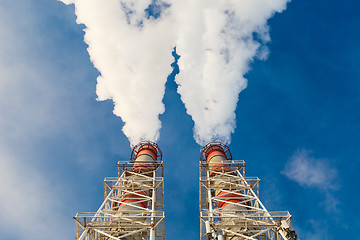 Image showing Stream of dark smoke from the chimney of factory