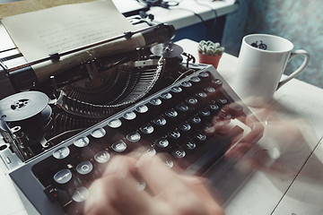 Image showing Writer typing with retro writing machine.