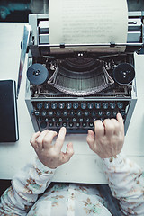 Image showing Writer typing with retro writing machine.