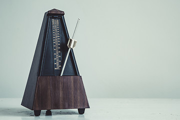 Image showing Color shot of a vintage metronome