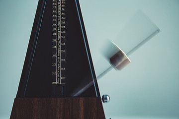 Image showing Color shot of a vintage metronome