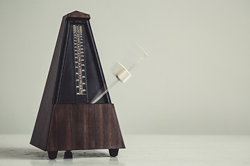 Image showing Color shot of a vintage metronome