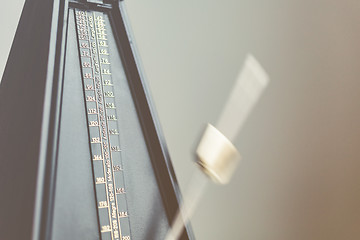 Image showing Color shot of a vintage metronome