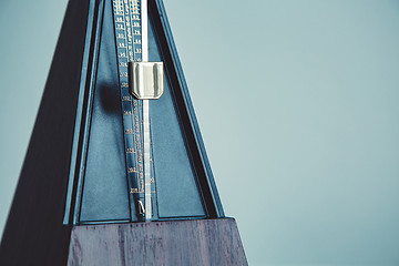 Image showing Color shot of a vintage metronome