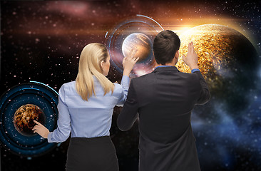 Image showing businessman and businesswoman over space