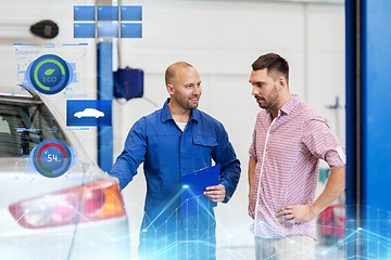 Image showing auto mechanic with clipboard and man at car shop