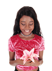 Image showing African woman holding pink lily