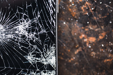 Image showing Big modern smartphone with broken screen debris