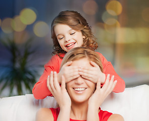 Image showing happy mother and daughter playing at home