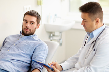 Image showing doctor and man with health problem at hospital