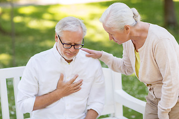 Image showing senior man feeling sick at summer park