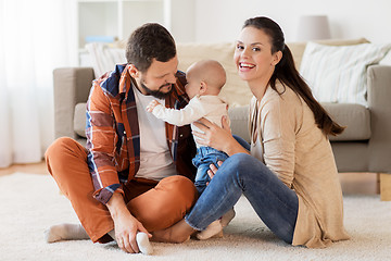 Image showing happy family with baby having fun at home