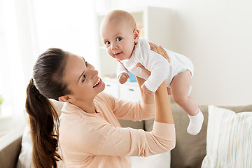 Image showing happy mother playing with little baby boy at home