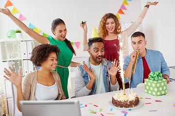 Image showing office team greeting colleague at birthday party