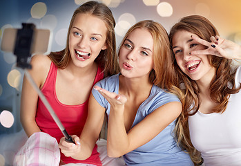 Image showing teen girls with smartphone taking selfie at home