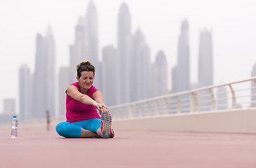 Image showing woman stretching and warming up