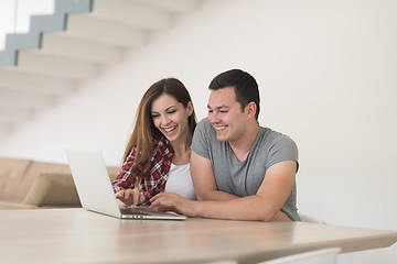 Image showing happy young couple buying online