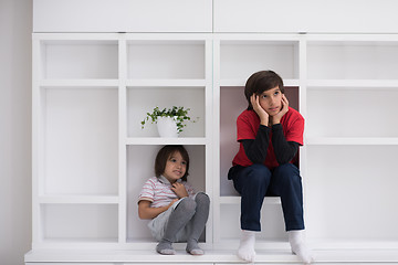 Image showing young boys posing on a shelf