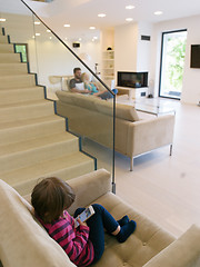 Image showing family with little girl enjoys in the modern living room