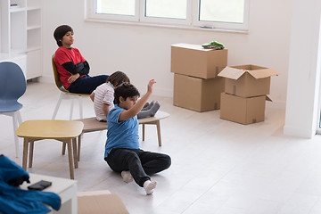 Image showing boys in a new modern home