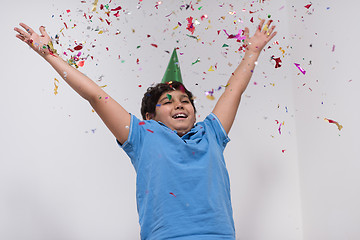 Image showing kid blowing confetti