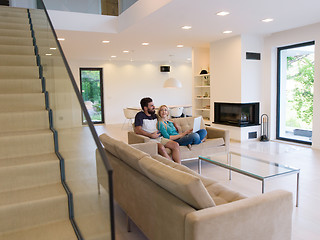 Image showing young happy couple relaxes in the living room