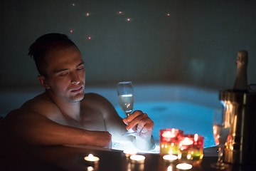 Image showing man relaxing in the jacuzzi