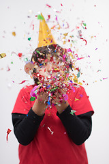 Image showing kid blowing confetti