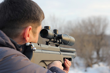 Image showing Hunter with rifle ready for shoot the target