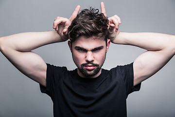 Image showing Portrait of brutal bearded man with horns