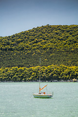 Image showing Small sail boat on lake Abrau