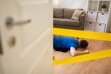 Image showing dead man body in blood on floor at crime scene