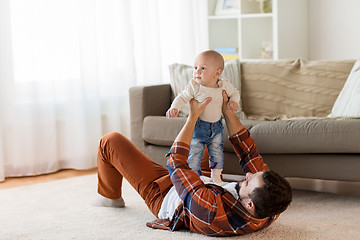 Image showing happy father with little baby boy at home