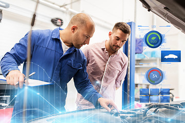 Image showing auto mechanic with clipboard and man at car shop