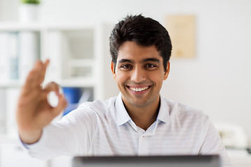 Image showing businessman showing ok hand sign at office