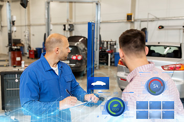 Image showing auto mechanic with clipboard and man at car shop