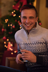 Image showing Happy young man with a glass of champagne