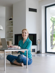 Image showing young women using laptop computer on the floor