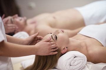 Image showing couple enjoying head massage at the spa