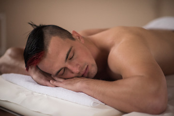 Image showing handsome man resting in a spa massage center