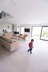 Image showing family with little girl enjoys in the modern living room