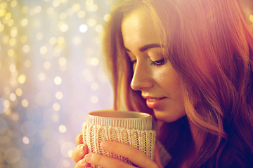 Image showing close up of happy woman with tea or coffee cup