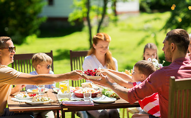 Image showing happy family having dinner or summer garden party