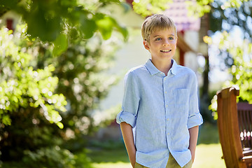 Image showing happy smiling boy at summer garden