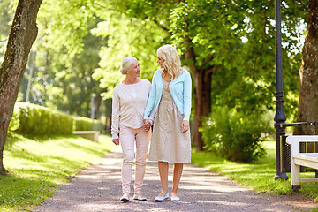 Image showing daughter with senior mother walking at summer park